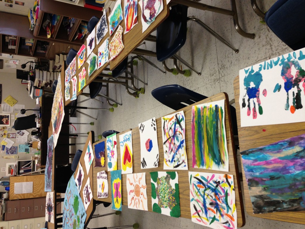 The students' art pieces were laid out around the classroom to vote on "Best in Show"