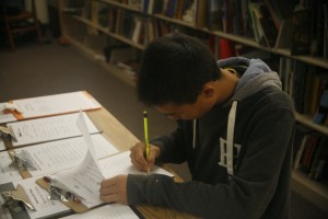 Student registering for college administration presentation.  Photo by Alex Doan.