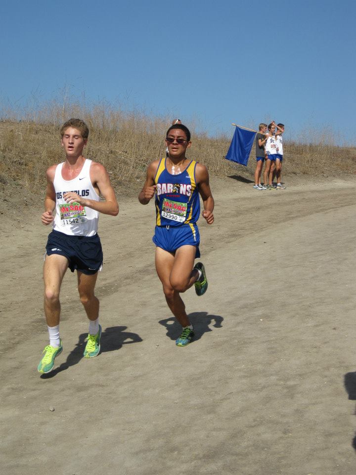 Kenneth Barios (15) racing over the top of Reservoir Hill