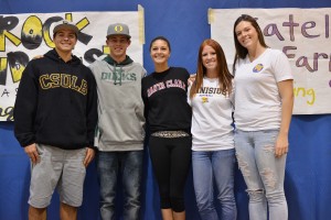 From Left: Brock Lindquist ('14), Daniel Patzlaff ('14), Kelli Tatum ('14), Madison Weathers ('14), and Katelyn Farrow ('14) sign their national letters of intent and embrace their families and friends during lunch on Wednesday. Photo by Tue Duong.