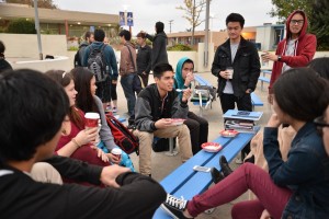 Seniors enjoy a cup of coffee or cinnamon rolls while acquainting with each other. Photo by Tue Duong 