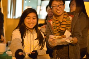 Kiwins member Kathy Le ('16) and Brian Wang ('15) served Chow Mein during the night. Photo by Ashley Le.