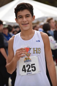 Robert Osorio ('15) earns a medal for being one of the top individuals of the race moving on to state. Photo by Tue Duong. 