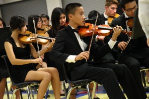 First violin members of the FVHS Orchestra perform at their winter concert, directed by Gary Wampler. Photo by Lilian Nguyen