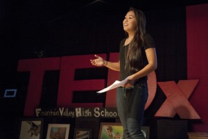 Student Nathalie Huynh ('15) presents spoken-word poetry.
