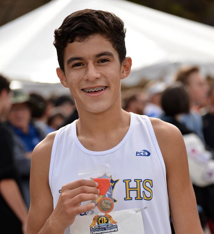 Robert Osorio ('15) wins a medal at the CIF Southern Section Championships at Mt. San Antonio College. Photo by Tue Duong