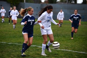 Selena Yaghoubi (’15) battles for the ball against a Sailor. Photo by Ashley Le.