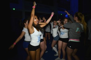 Sarah Sulewski ('15) dances the night away with friends at Pack the Gym. Photo by Tue Duong