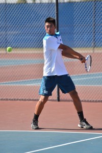 Darrin Nguyen ('14) returns a hit with a backhand. Photo by Tue Duong