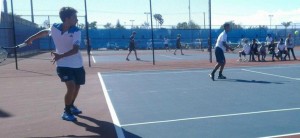 Parker Braverman ('15) left and Darrin Nguyen ('14) right return the ball during their doubles match. 