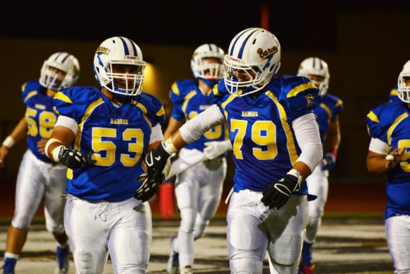 Ennis Khaleq ('15) and Cole Chambers ('15) celebrate after scoring the 1st touchdown. Photo by Ashley Le.