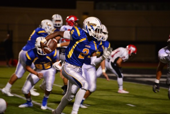 Kent Swift ('16) gets free for a touchdown run in the second quarter of the game. Photo by Ashley Le.