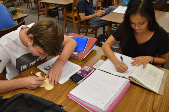 Christine Cao ('16) and Justin Dimeck ('16) study and work to finish the first few assignments of the school year. 
