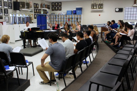 The Alumni Choir practices one of their songs for the upcoming Christmas concert. photo by Heather Kim 