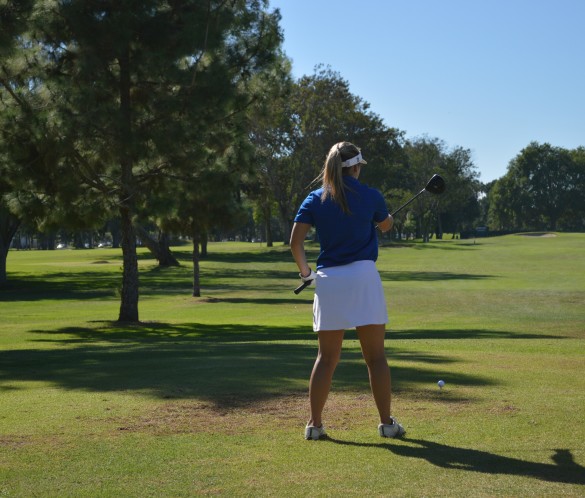 Melissa Kittredge ('17) practices her swings before the match begins. Photo by Mackenzie HIll