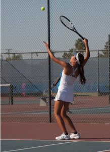 Ruth Nguyen ('16) sets up her serve for the final doubles match.  Photos by Thien Le. 