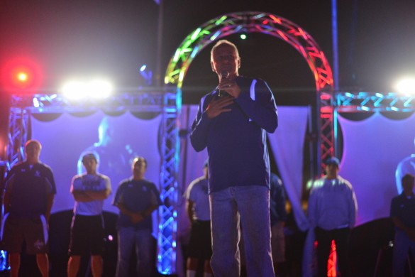 Football coach Ray Fenton assures the Barons' chance of winning by starting the chant "I believe that we will win." Photo by Ashley Le.