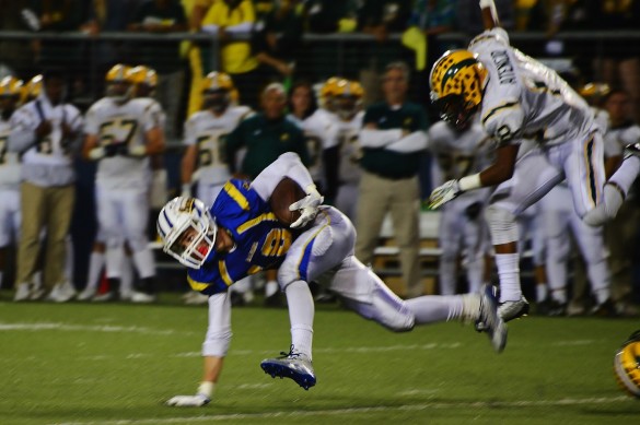 Wide receiver Ryan Finley ('15) managed to escape a tackle from an Edison charger during the third quarter. Photo by Ashley Le