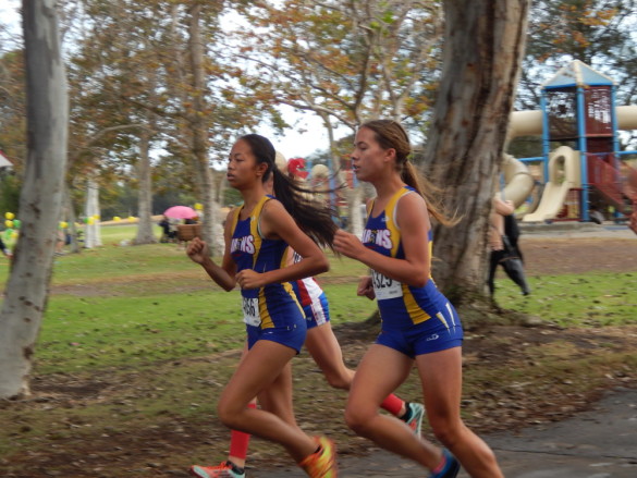 Lynn Vo ('17) and Savannah Bushman ('18) lead the team while approaching the 0.75 mile mark.