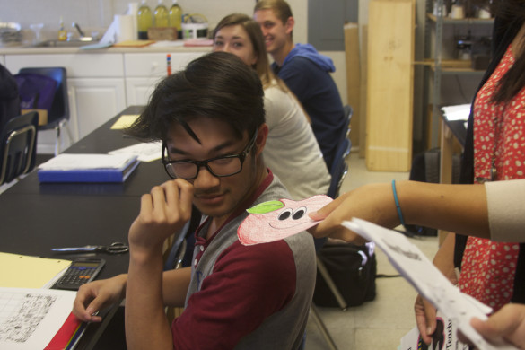 Justin Cao ('15) receives a welcoming surprise from Senior Commission's appreciation gram. Photo by Thien Le