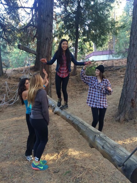 Amy Tran ('15) and other members of Concert Choir participate in a trust exercise. 