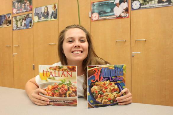 Taylor Carr ('16) advertises her cookbooks. Picture by Zainab Khan