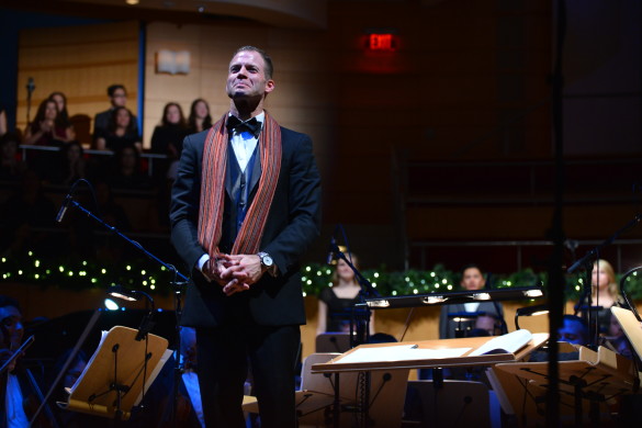 Choir director Kevin Tison proudly presents Sounds of the Season at Segestrom concert hall. Photo by Ashley Le.