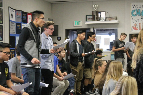 Concert Choir practices one of their many songs for Sounds of the Season.
