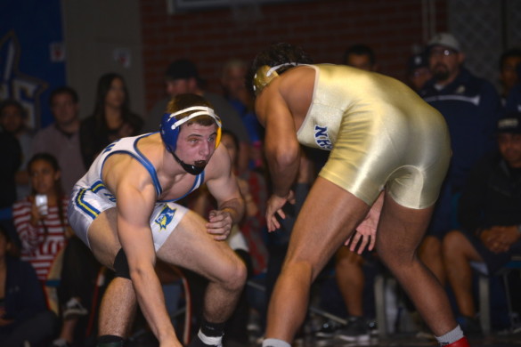 Andrew Morgan ('15) wrestles against Anthony Valencia during the Five Counties Finals in the 170 weight class. Photo by Ashley Le.