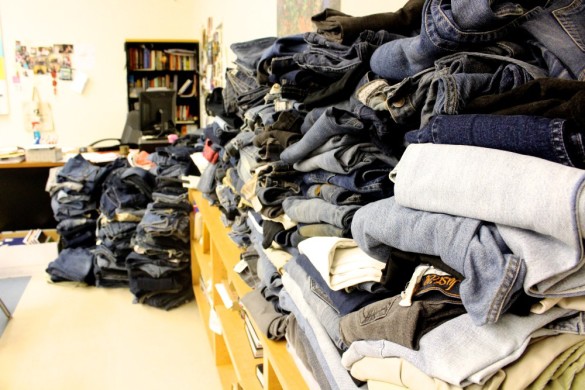 Over 500 pairs of jeans are stacked up in Mrs. Palmer's classroom for the Teens for Jeans fundraiser. Photo by Heather Kim.