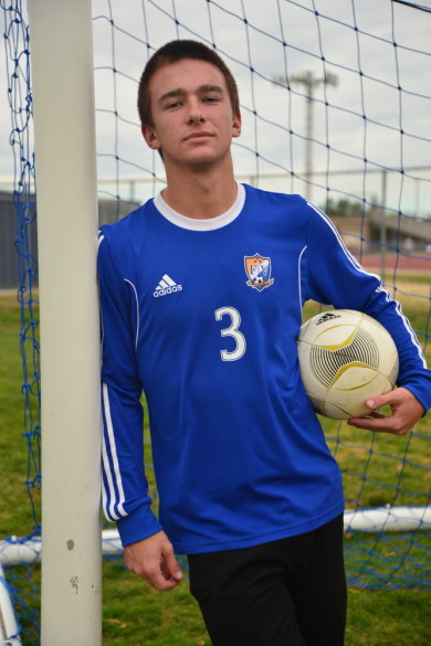 Co-captain Larry Turner (‘15) poses on the varsity soccer field as he looks forward to his last games with the Barons’ boys soccer team. Photo by Ashley Le