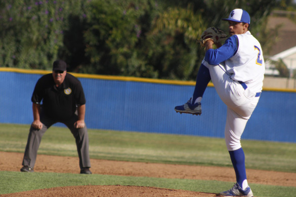 William Aguilar ('15) throws a pitch to opposing team. Photo by C.J. Wells.
