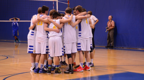 Varsity huddles before their game begins. Photo by Kevin Le