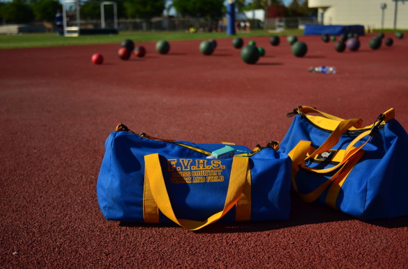Cross country and track equipment that are used by students. Training balls are seen in the background. Photo by Steve Phan.