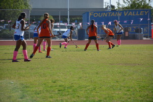 Chantelle Sanchez ('19) pushes ball into HB territory.