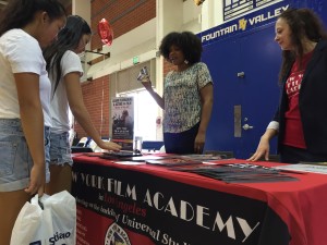 Student checks out the New York Film Academy booth. Photo by Sean Ziebarth