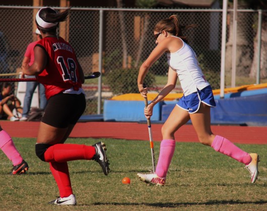 Elyse Toal ('16) dribbles through Westminster's defensive line. Photo by Julia Pacis