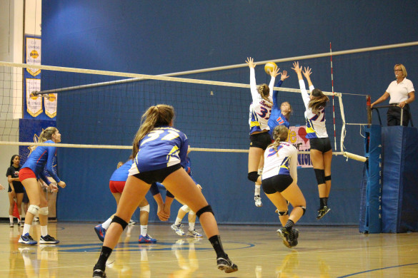 Girls varsity volleyball demonstrate strong defense on the court against Los Al. Photo by Michelle Nhi Nguyen