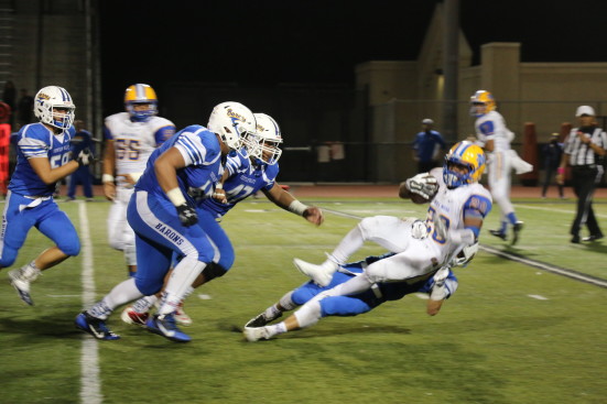 Our defensive line tackles down Mira Mesa. Photo by Sandra On. 