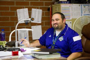 Ryan McKernan poses for a picture while doing his job. Photo by Stacey Hall.