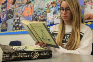 Skylar Cunningham ('19) reads The Odyssey during class before she reads To Kill a Mockingbird. Photo by Julia Pacis
