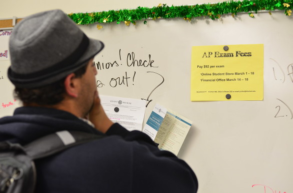 Arsani Awadalla ('17) checks when to pay his AP exam fees.