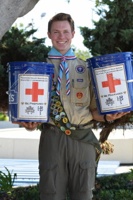 Austin Gergens ('17) showcases his disaster buckets. Photo by Jamie Pham, staff photographer