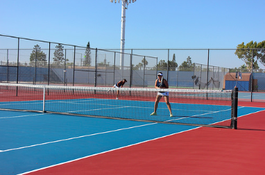 Captains of the team, Katie Ho ('17) and Clarissa Htay ('17) plays doubles one. Photo by Ivy Duong.