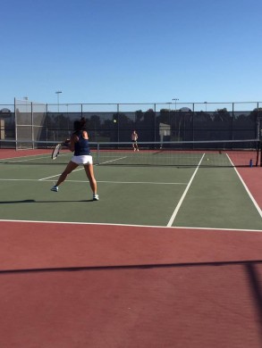 Senior Captain Katie Ho ('17) hits a powerful top spin forehand against the Oilers. Photo by Aozora Ito. 