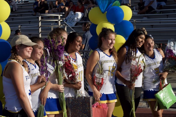 Seniors from the Varsity and Junior Varsity team come together to celebrate their last game of the season and high school. 