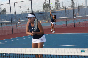 Clarissa Htay ('17) and Katie Ho ('17) serves while Clarissa prepares herself against Los Alamitos