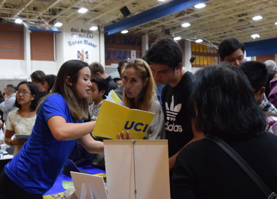 Parents and students gather around a booth at the Huntington Beach Union High School District Annual College and Career Night hosted by Fountain Valley High School. Photo by Laura Le