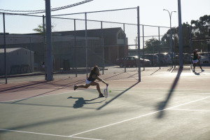 No. 3 doubles Jane Nguyen ('17) dashes up to the baseline to hit a short ball. Photo by Aozora Ito