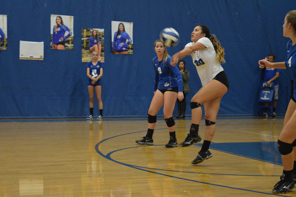 Britney Tran ('17) digs an extremely hard hit from the opposing Huntington Beach. Picture By Jaimie Pham